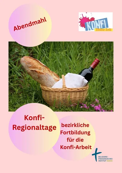 Picknickkorb mit Brot und Wein auf einer Wiese